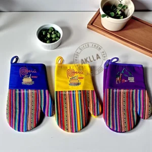 Three kitchen mittens in assorted colors made with Peruvian fabric, shown for color variety, sold individually