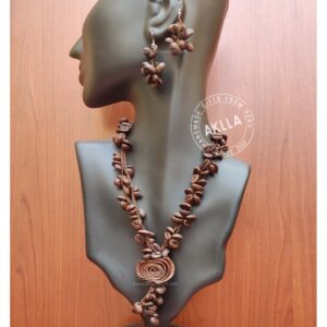 Beautiful coffee bean necklace and earrings set with orange peel rose. Handwoven in Peru.