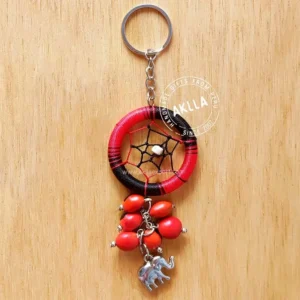 Dream Catcher Keychain handmade in Peru with huayruro seeds, offered by wholesalers worldwide