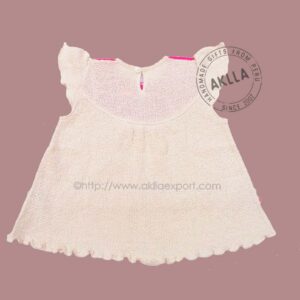 Back view of handmade baby girl dress from Peru, organic cotton clothing