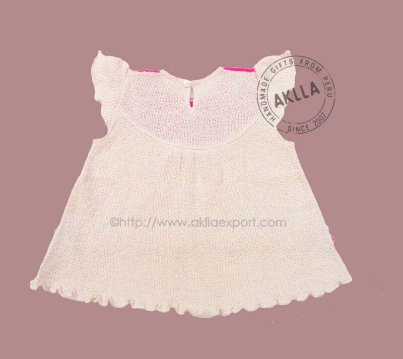 Back view of handmade baby girl dress from Peru, organic cotton clothing