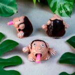 Ceramic monkey figurines. Funny moving tongue with banana