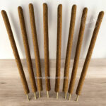 Natural Palo Santo Incense sticks arranged in a neat bundle, showcasing their rich, earthy color and texture against a neutral background