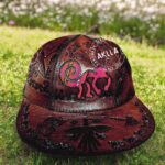 Handmade embossed leather caps with Peruvian iconography and Andean fabric, available in various colors and designs