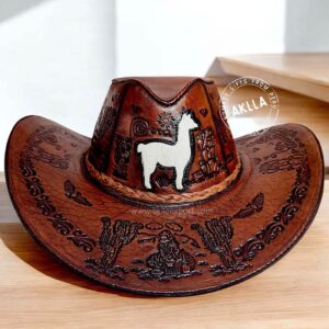 Handmade embossed leather cowboy hats with Peruvian iconography, Andean characters, and a braided leather cord, featuring a llama-shaped leather detail – Made in Peru