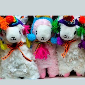 Close-up of the embroidered face of the llama stuffed toy, showcasing its sweet eyes, tender smile, and carefully crafted details. A warm and endearing addition to any collection.