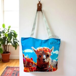 Llama tote bags from Peru hanging on a wooden coat rack