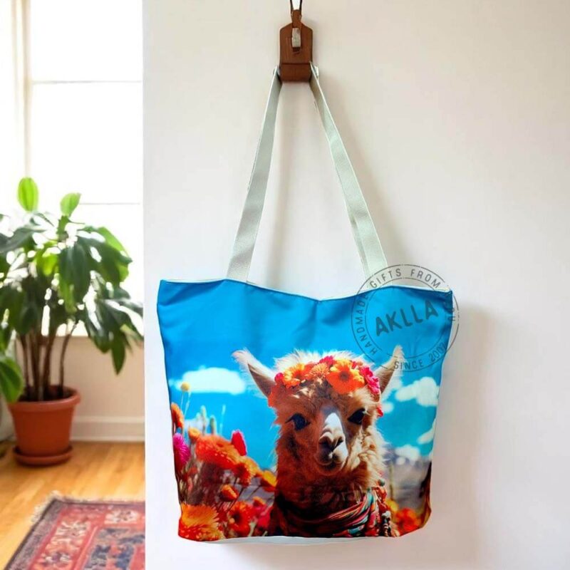 Llama tote bags from Peru hanging on a wooden coat rack