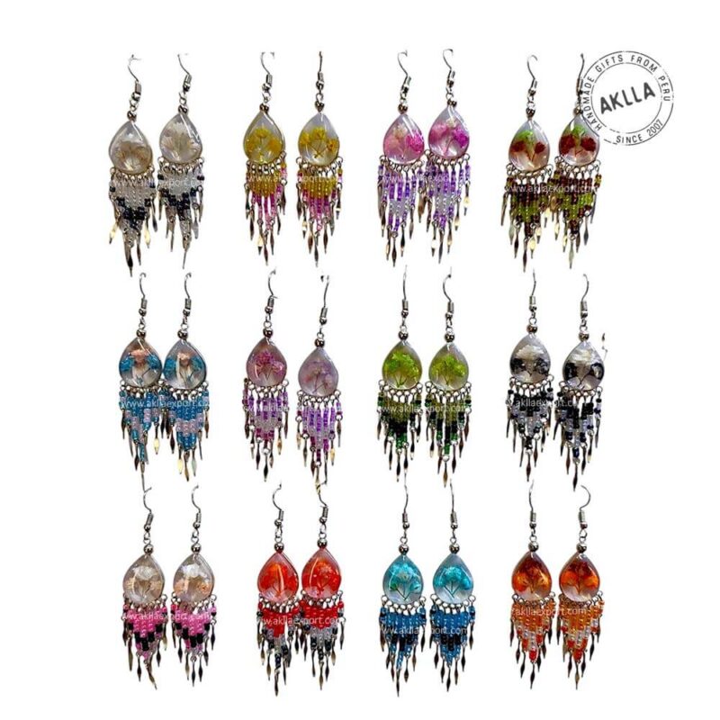 Variety of handmade Tree Life earrings from Peru shown in a group of 12 pairs