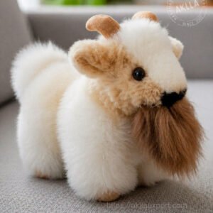 Handmade alpaca stuffed toy goat in 100% alpaca fiber standing on sofa showing full artisan detail and texture