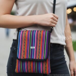 Close-up front view of handmade Andean crossbody bag showing vibrant woven textile pattern and flap clasp
