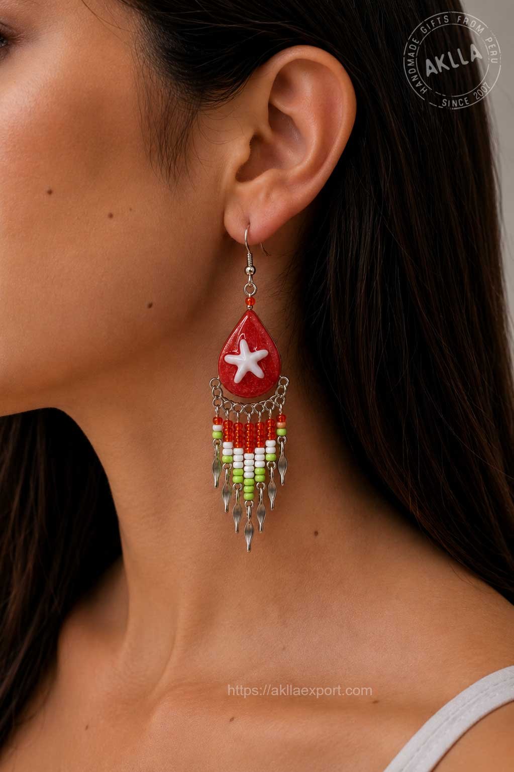 Beaded Earrings Handmade – Red Resin Starfish Teardrop with Glass Bead Fringe Worn by Model Woman wearing handmade beaded earrings in red resin teardrop with starfish and colorful glass bead fringe