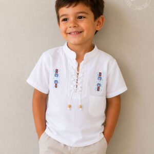 Boy wearing hand embroidered white cotton boys shirt with geometric patterns mandarin collar and lace-up neckline